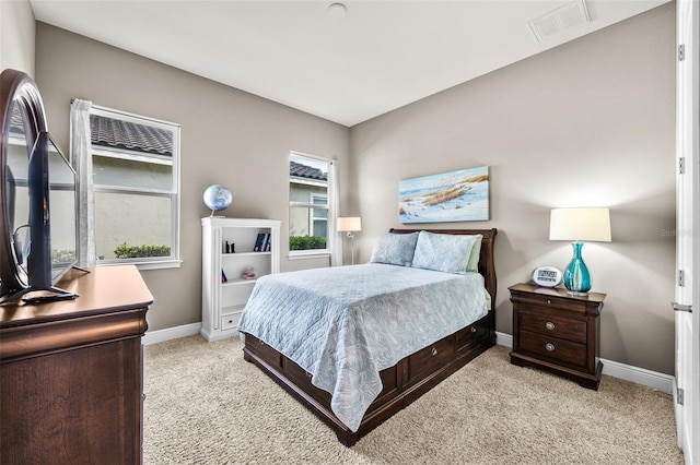 bedroom featuring light colored carpet