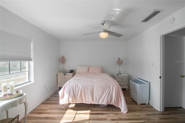 bedroom with ceiling fan and light hardwood / wood-style flooring