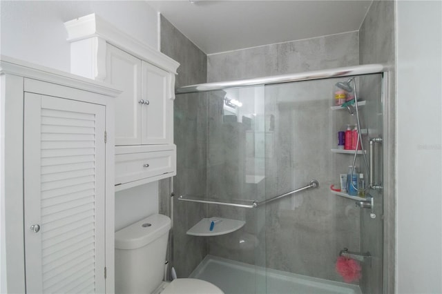 bathroom with toilet and walk in shower