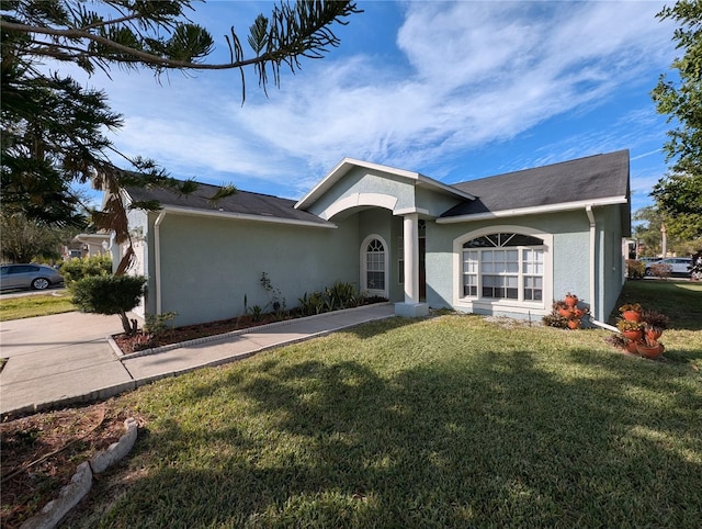 ranch-style house with a front yard