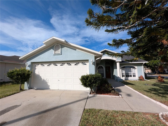 single story home featuring a garage and a front yard