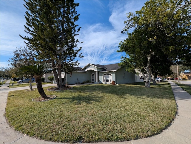 single story home featuring a front yard