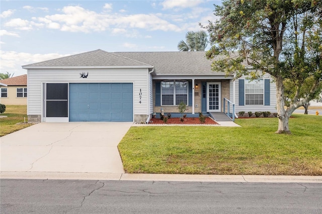 ranch-style house with a garage and a front yard