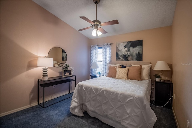 carpeted bedroom with vaulted ceiling and ceiling fan