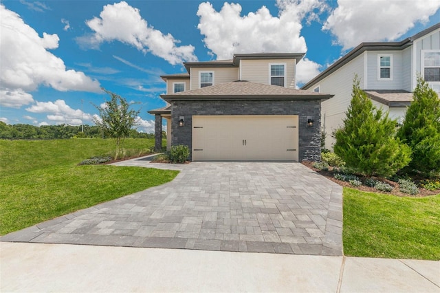 view of front facade featuring a garage and a front lawn