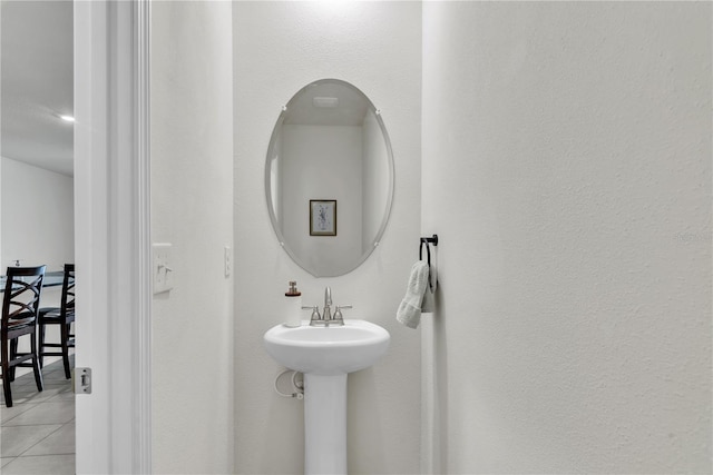 bathroom featuring tile patterned flooring and sink