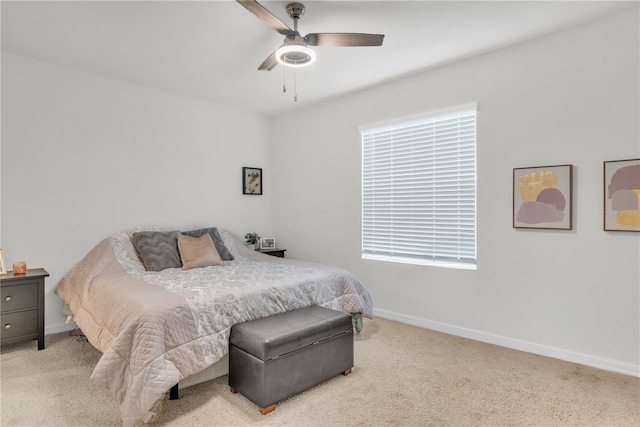 bedroom with light carpet and ceiling fan