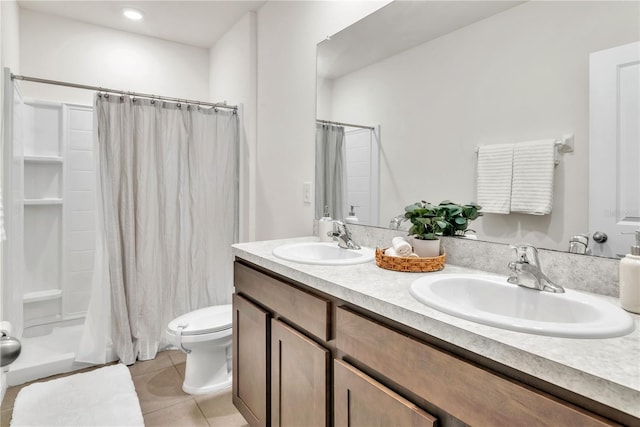 bathroom with tile patterned floors, vanity, toilet, and a shower with curtain