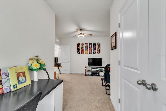 interior space with light carpet and ceiling fan