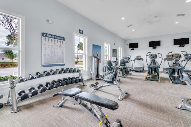 gym with light colored carpet and ceiling fan