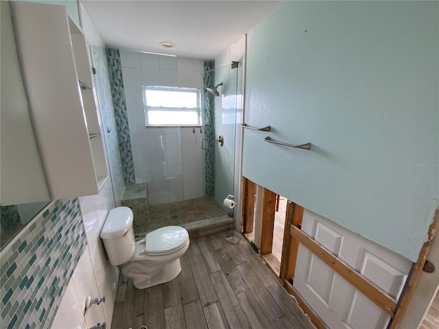 bathroom with toilet and walk in shower