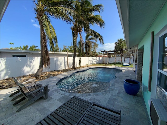 view of pool with a pergola and a patio area