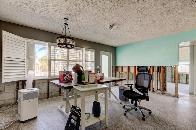 home office featuring a textured ceiling