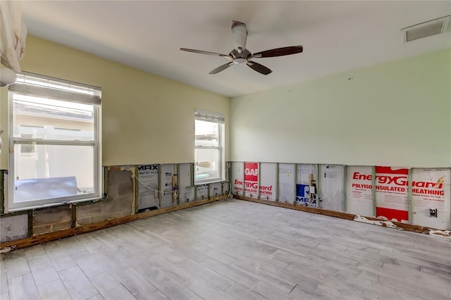 unfurnished room with ceiling fan and light hardwood / wood-style floors