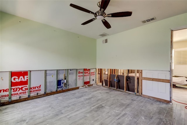 unfurnished room with hardwood / wood-style flooring and ceiling fan