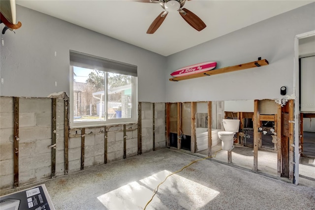 bedroom with ceiling fan and ensuite bathroom