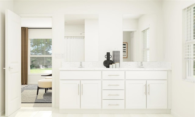 bathroom with tile patterned flooring and vanity