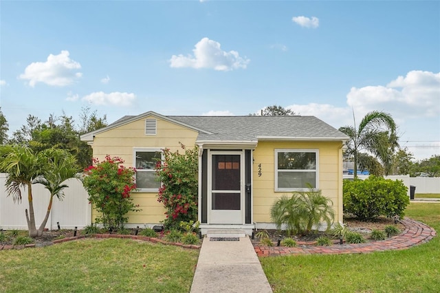 429 Rotary Pl NE, Saint Petersburg, FL 33703 - view of front facade with a front lawn