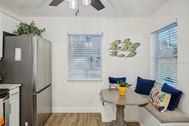 dining space featuring breakfast area and light hardwood / wood-style flooring