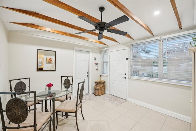 dining room with light tile patterned floors, vaulted ceiling with beams, and ceiling fan