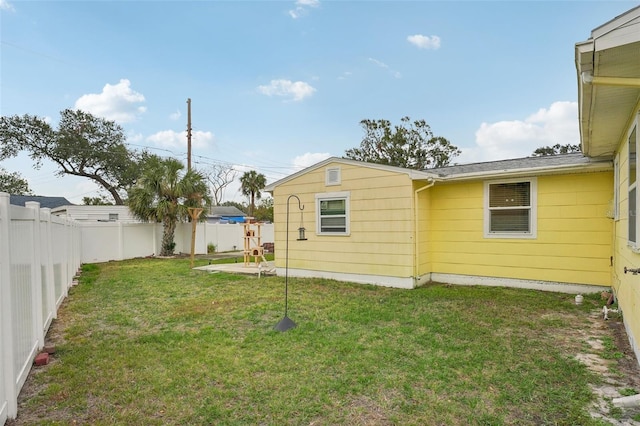 back of house featuring a yard