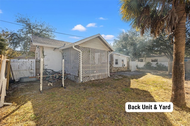 view of side of home featuring a lawn