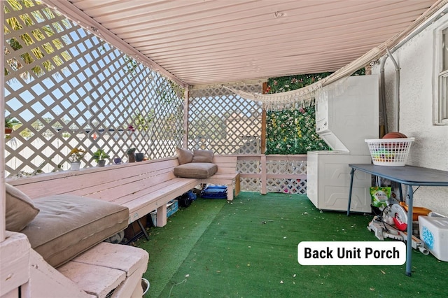 view of patio / terrace with stacked washer / drying machine