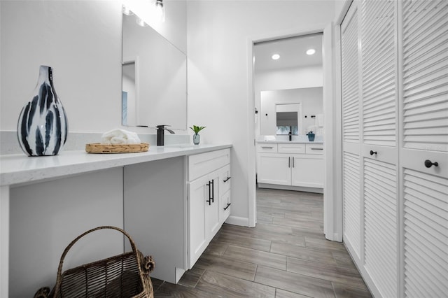 bathroom featuring hardwood / wood-style floors and vanity