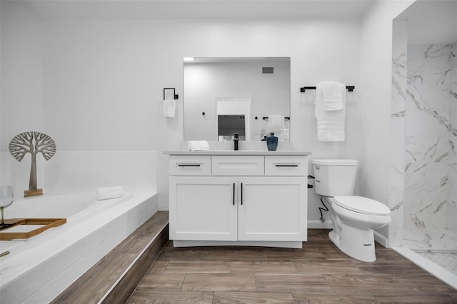 full bathroom with wood-type flooring, vanity, toilet, and independent shower and bath