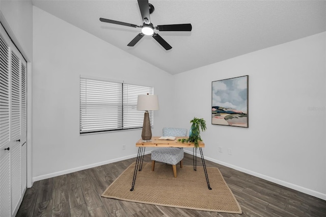 home office featuring ceiling fan, dark hardwood / wood-style flooring, and vaulted ceiling