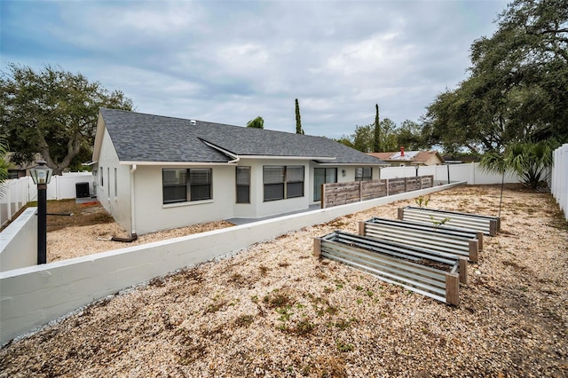 back of property featuring cooling unit