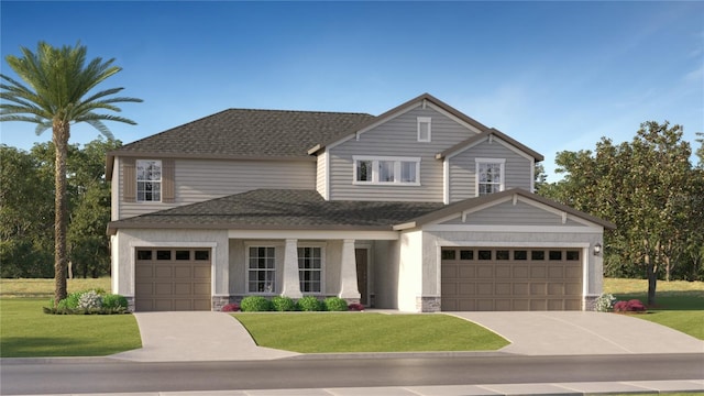 view of front facade featuring a front yard and a garage