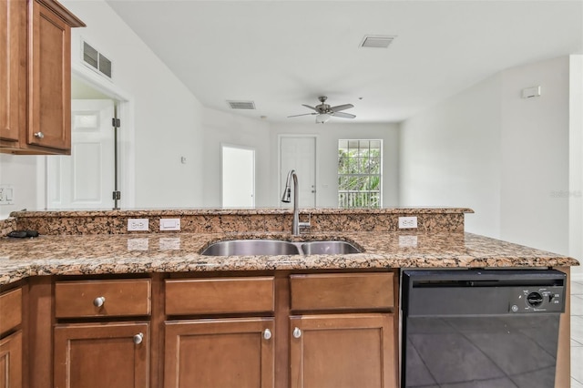 kitchen with ceiling fan, dishwasher, sink, and stone counters