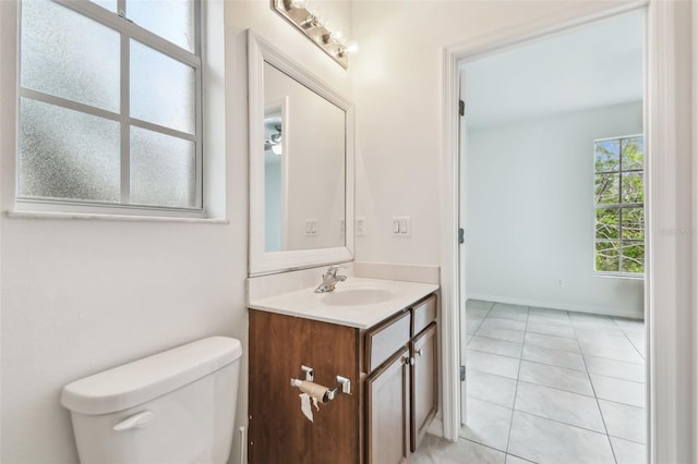 bathroom featuring tile patterned floors, vanity, and toilet