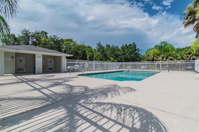 view of swimming pool with a patio area