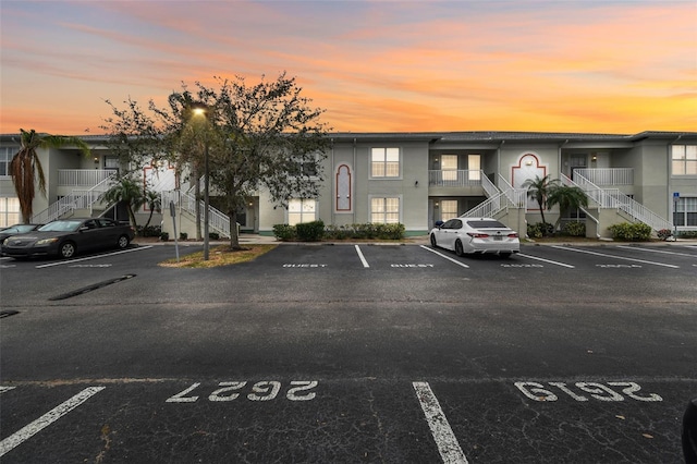 view of outdoor building at dusk