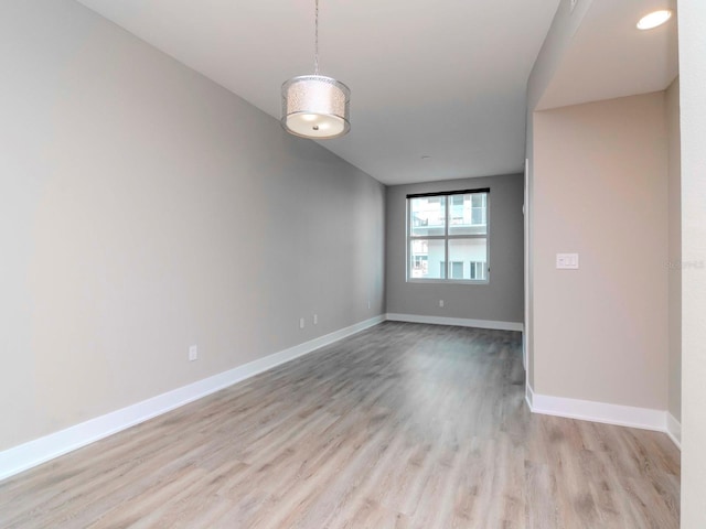 spare room with light hardwood / wood-style floors