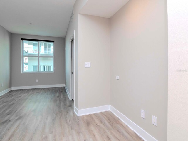 1120 E Kennedy Blvd Unit 927, Tampa, FL 33602 - spare room featuring light wood-type flooring and baseboards