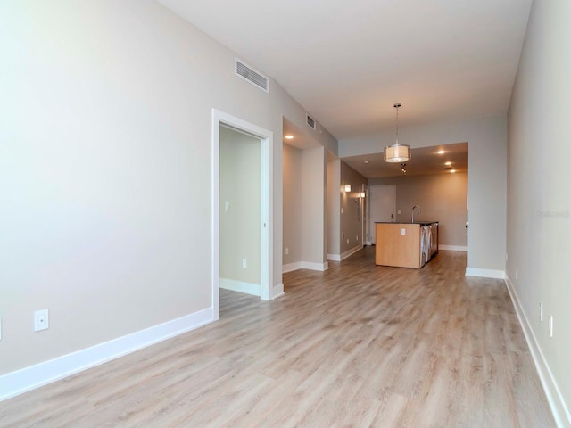 unfurnished living room featuring light hardwood / wood-style floors