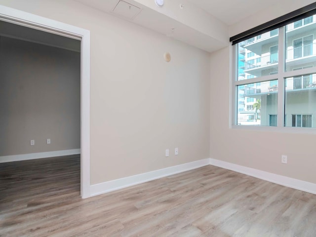 spare room featuring light hardwood / wood-style floors