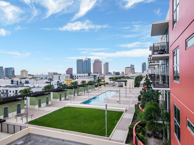 1120 E Kennedy Blvd Unit 927, Tampa, FL 33602 - community pool with a skyline view and a yard