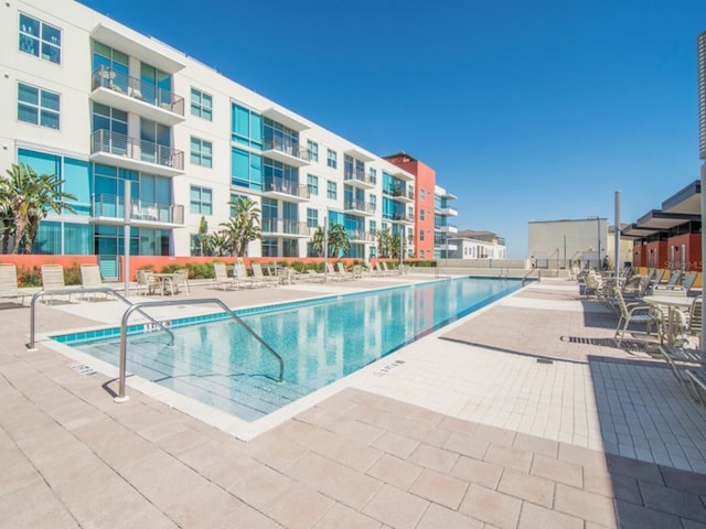 view of swimming pool with a patio