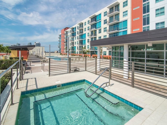 view of swimming pool with a patio