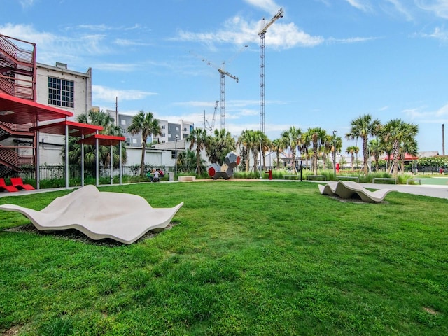 view of property's community featuring a lawn