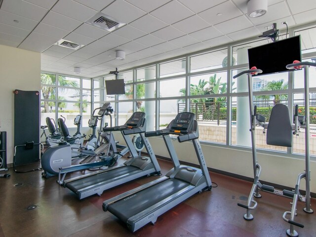 1120 E Kennedy Blvd Unit 927, Tampa, FL 33602 - gym with baseboards and a drop ceiling