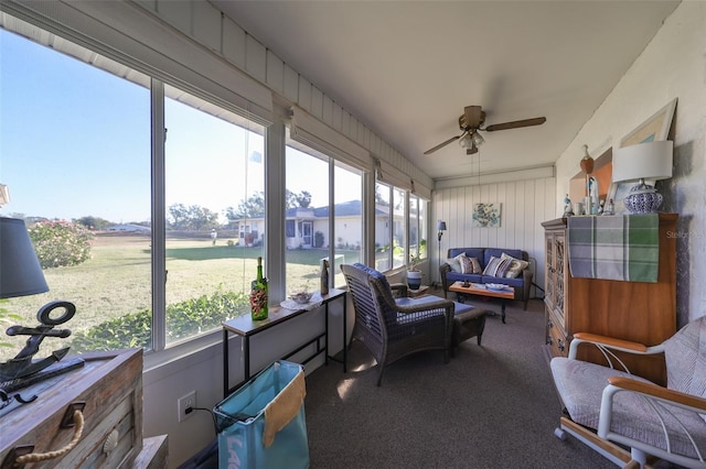 sunroom featuring ceiling fan