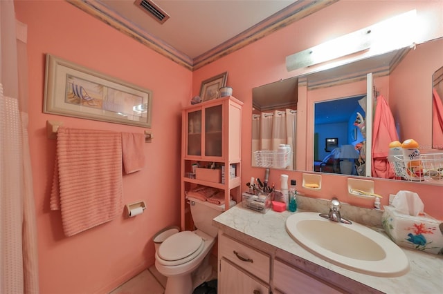 bathroom with crown molding, tile patterned flooring, vanity, and toilet