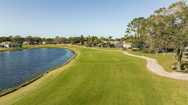 view of home's community featuring a yard and a water view