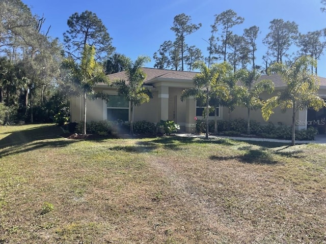 view of front of home featuring a front lawn