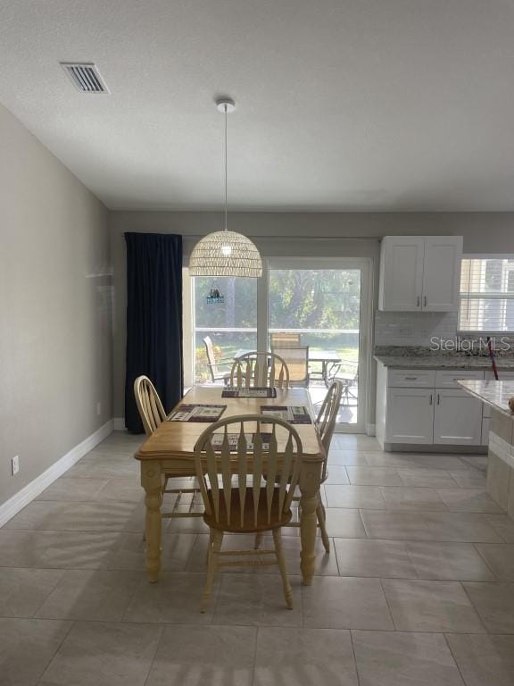 dining room featuring light tile patterned floors